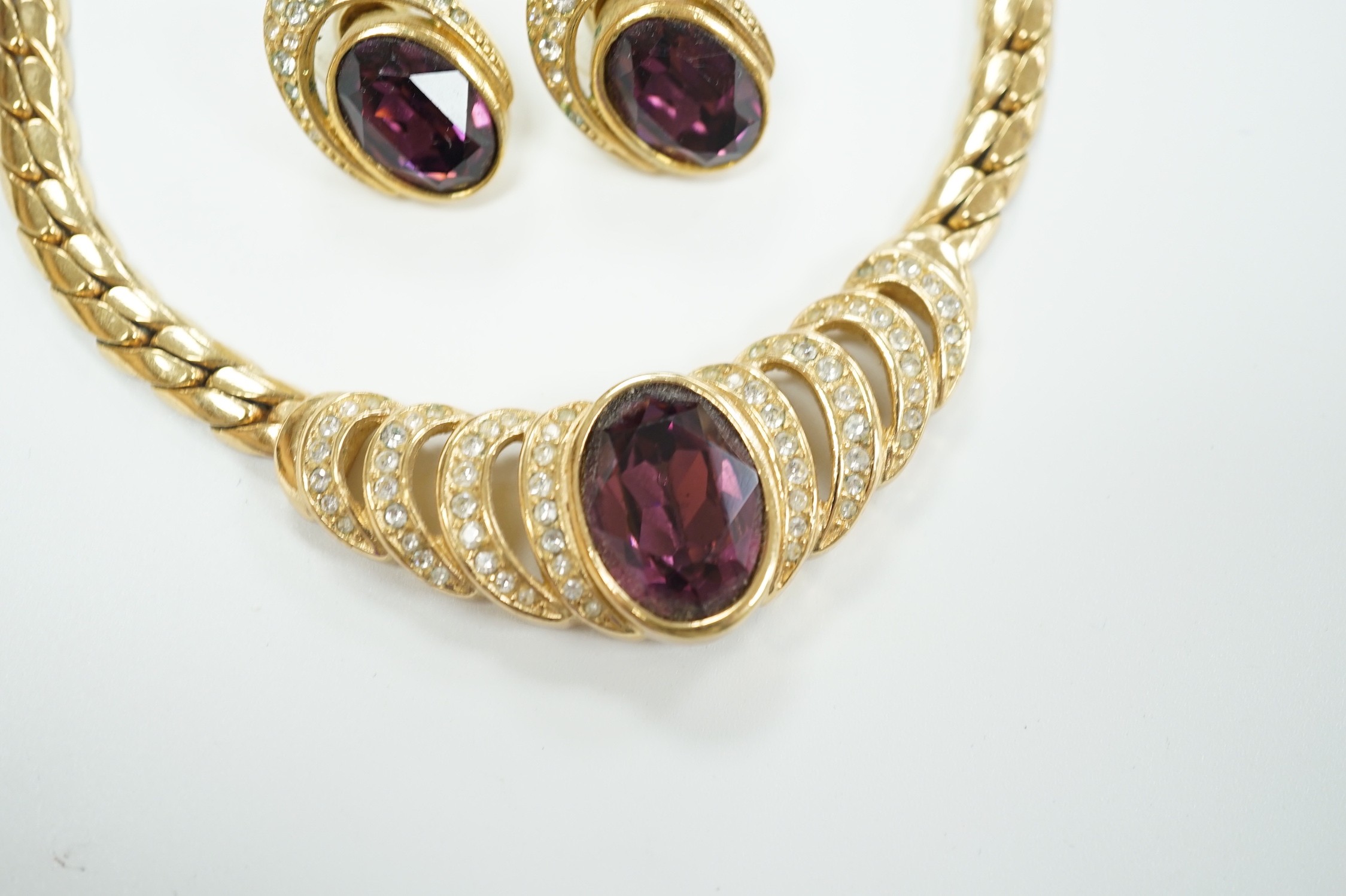 A Christian Dior gilt metal and two colour paste set costume necklace, 36cm and a pair of matching earrings.